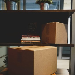 a room with books and boxes