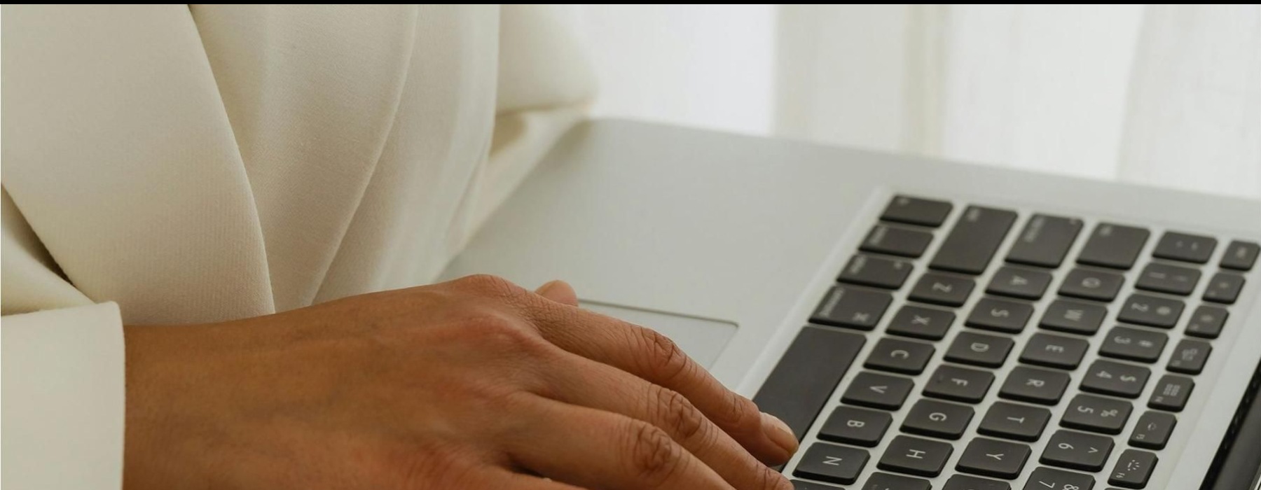 a person typing on a laptop