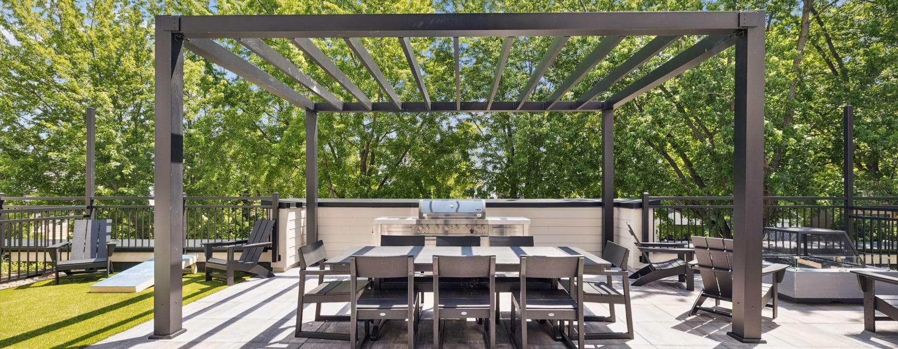 Patio space with seating areas, grill, and fire pit